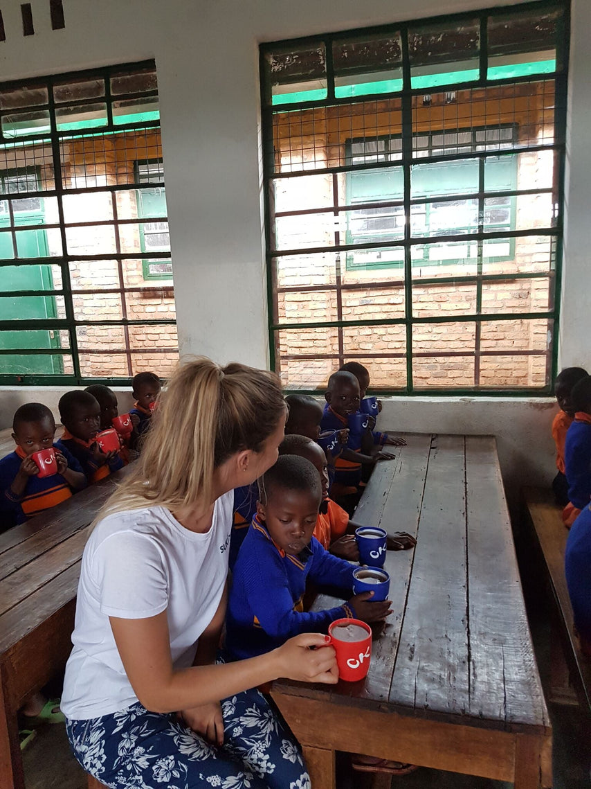 Zoë visits the children in Sorwathe|Sorwathe Fairtrade School|Enjoying a cup of porridge|Rwanda Tea plucking|Enjoying a cup of porridge||