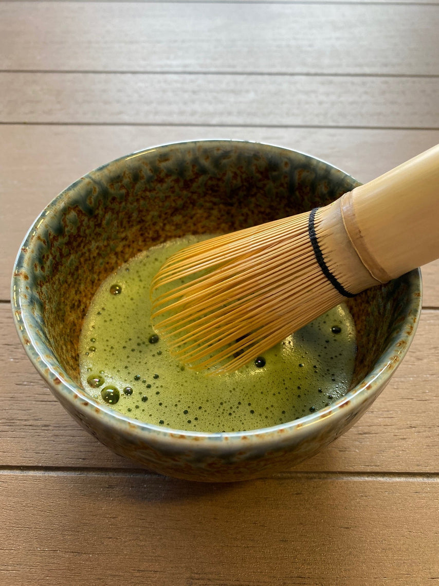 Suki matcha being whisked.