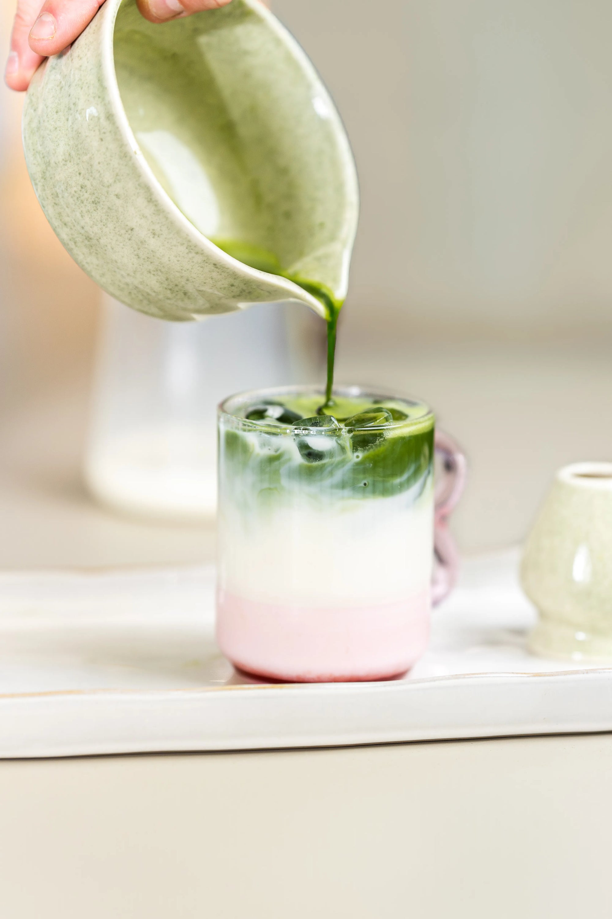 SUKI organic matcha whisked in a bowl